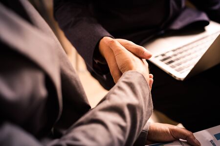 Businessman shaking hands to seal a deal with his partnerの写真素材