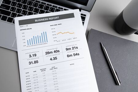 Laptop with  graph chart report screen on work table. Home office or work space. Strategy analysis financial accounting conceptの写真素材