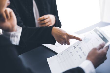 Group of business people busy discussing financial matter during meeting. Asian peopleの写真素材