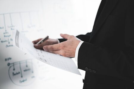 Businessman analyzing investment charts with laptop. Accounting conceptの写真素材