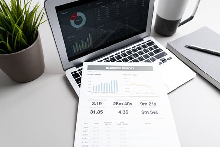 Laptop with  graph chart report screen on work table. Home office or work space. Strategy analysis financial accounting conceptの写真素材