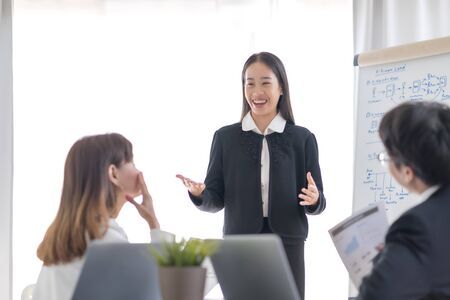 Group of business people busy discussing financial matter during meeting. Asian peopleの写真素材