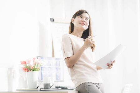 Young asia woman working at home or in a small office. Asian peopleの写真素材