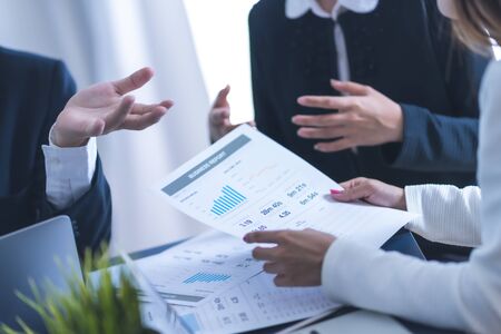 Group of business people busy discussing financial matter during meeting. Asian peopleの写真素材