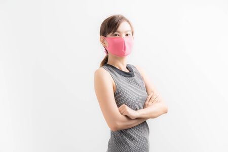 Close up portrait of young woman with medicine health care mask against white white background. CoronaVirus, Covid-19. Asian peopleの写真素材