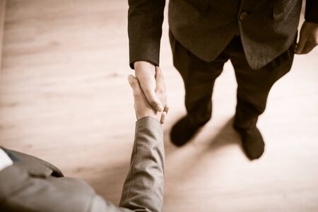 Businessman shaking hands to seal a deal with his partnerの写真素材