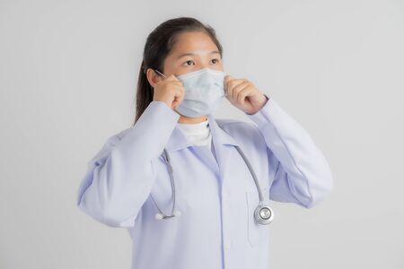 Doctor woman wearing protection face mask against coronavirus.Asian peopleの写真素材