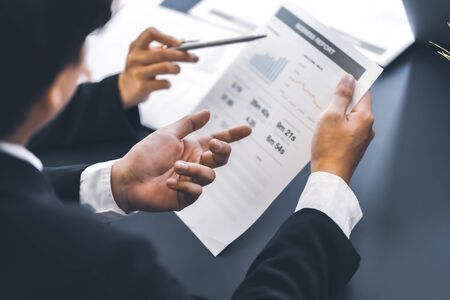 Group of business people busy discussing financial matter during meeting. Asian peopleの写真素材