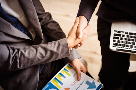 Businessman shaking hands to seal a deal with his partnerの写真素材