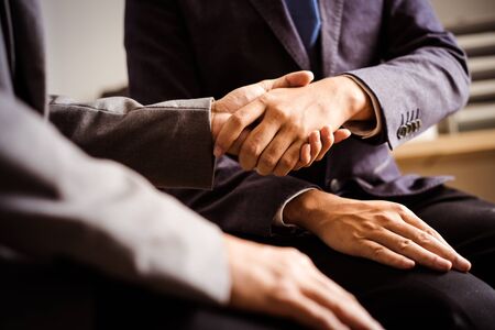Businessman shaking hands to seal a deal with his partnerの写真素材