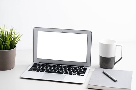 Laptop with blank screen on work table. Home office or work space conceptの写真素材