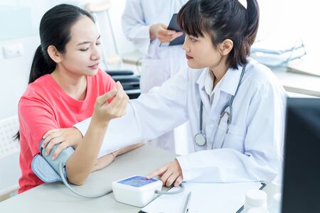 Female doctor consulting patient. Asian peopleの写真素材
