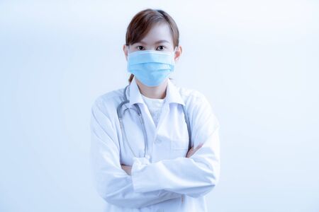 Doctor woman wearing protection face mask against coronavirus.Asian peopleの写真素材