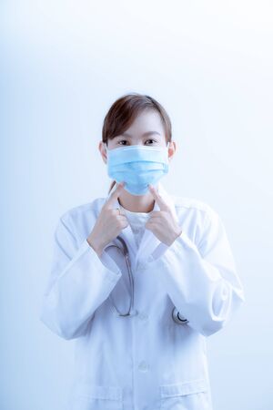 Doctor woman wearing protection face mask against coronavirus.Asian peopleの写真素材