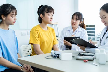 Female doctor consulting patient. Asian peopleの写真素材