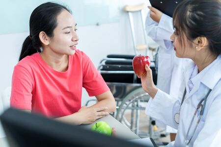Female doctor consulting patient. Asian peopleの写真素材