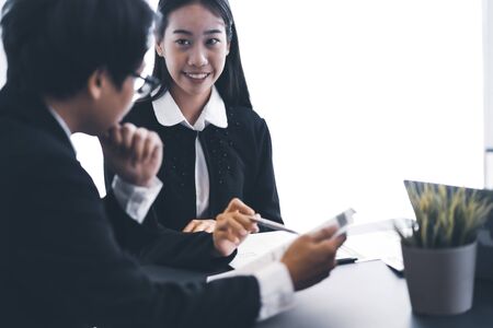 Group of business people busy discussing financial matter during meeting. Asian peopleの写真素材