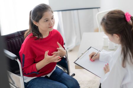 Female doctor consulting patient. Asian peopleの写真素材