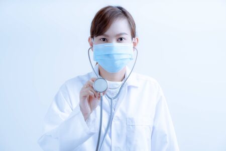 Doctor woman wearing protection face mask against coronavirus.Asian peopleの写真素材