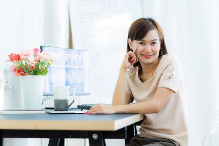 Young asia woman working at home or in a small office. Asian peopleの写真素材