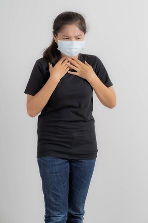 Close up portrait of young woman with medicine health care mask against white white background. CoronaVirus, Covid-19. Asian peopleの写真素材