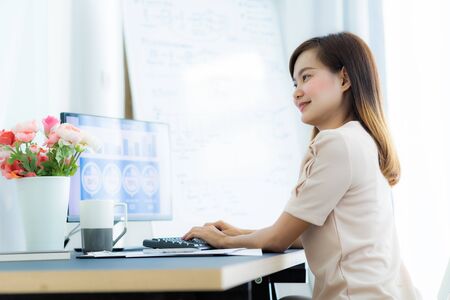 Young asia woman working at home or in a small office. Asian peopleの写真素材