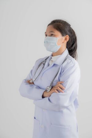 Doctor woman wearing protection face mask against coronavirus.Asian peopleの写真素材