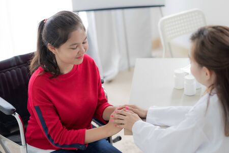 Female doctor consulting patient. Asian peopleの写真素材