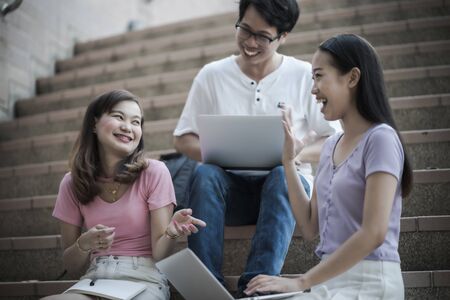 Group of happy teen high school students outdoors. Asian peopleの写真素材