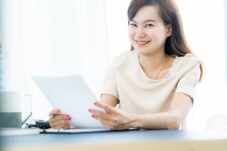 Young asia woman working at home or in a small office. Asian peopleの写真素材