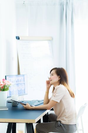 Young asia woman working at home or in a small office. Asian peopleの写真素材
