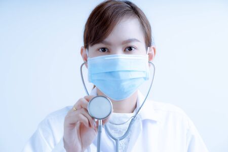 Doctor woman wearing protection face mask against coronavirus.Asian peopleの写真素材