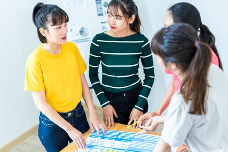 Asian female Designers Having Brainstorming Meeting In Officeの写真素材