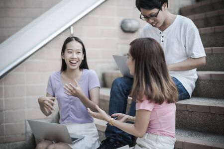 Group of happy teen high school students outdoors. Asian peopleの写真素材