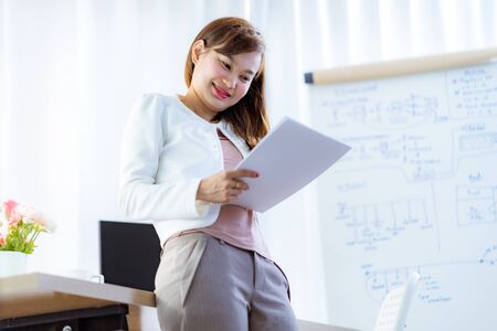 Young woman working at home or in a small office. Asian Peopleの写真素材