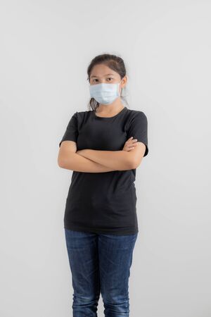 Close up portrait of young woman with medicine health care mask against white white background. CoronaVirus, Covid-19. Asian peopleの写真素材