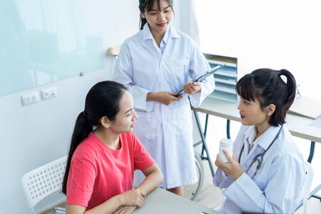 Female doctor consulting patient. Asian peopleの写真素材