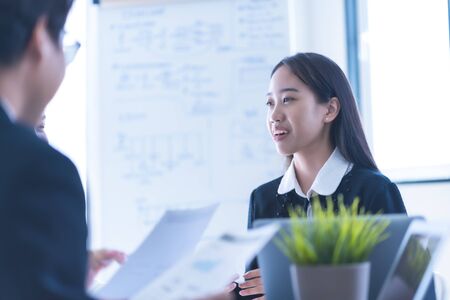 Group of business people busy discussing financial matter during meeting. Asian peopleの写真素材