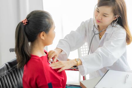 Female doctor consulting patient. Asian peopleの写真素材