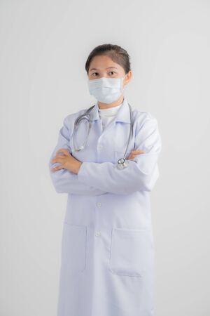 Doctor woman wearing protection face mask against coronavirus.Asian peopleの写真素材