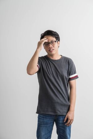 Man feel headache with white background, asian peopleの写真素材