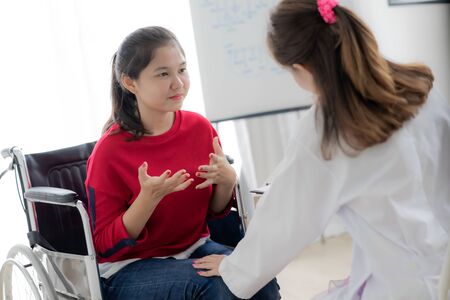 Female doctor consulting patient. Asian peopleの写真素材