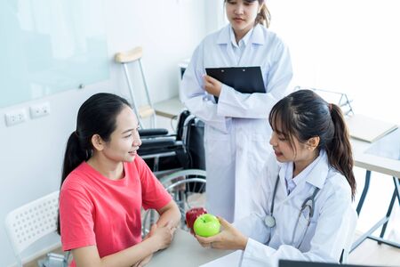 Female doctor consulting patient. Asian peopleの写真素材