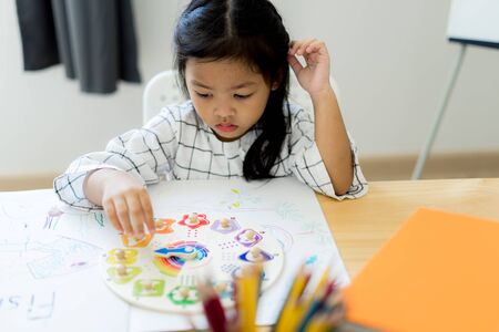Asian cute little child girl drawing at home. Education conceptの写真素材