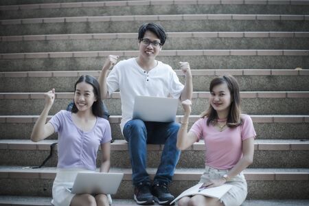 Group of happy teen high school students outdoors. Asian peopleの写真素材
