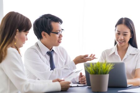 Group of business people busy discussing financial matter during meeting. Asian peopleの写真素材