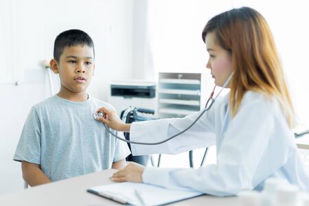 Asian little boy visiting a doctor. Medicine and children's therapy conceptの写真素材