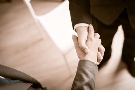 Businessman shaking hands to seal a deal with his partnerの写真素材