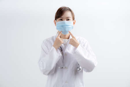 Doctor woman wearing protection face mask against coronavirus.Asian peopleの写真素材