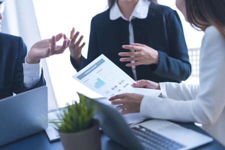 Group of business people busy discussing financial matter during meeting. Asian peopleの写真素材
